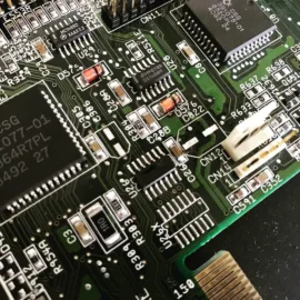 Amiga 1200 mainboard caps removed and pads cleaned up